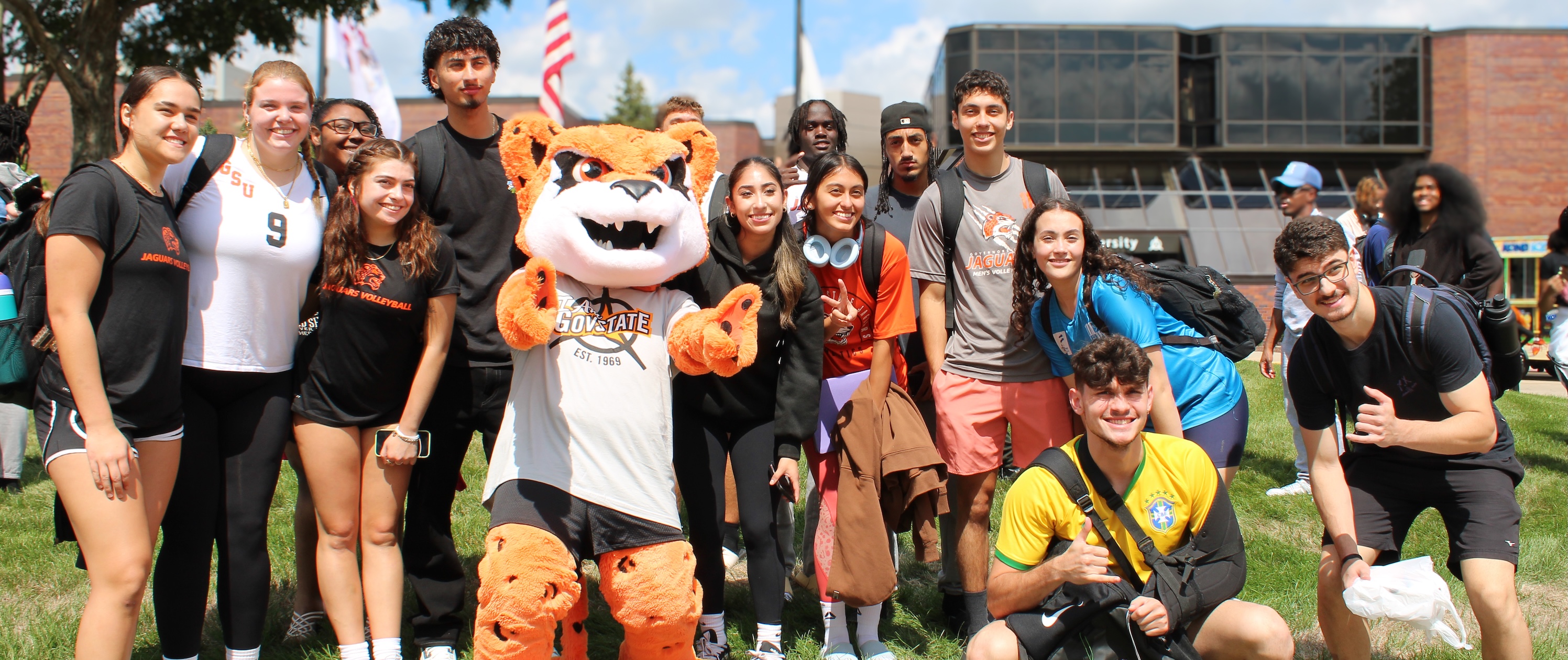 Jax with students outside of GovState Main Entrance